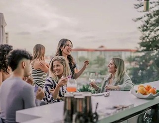 Friends gathered at the rooftop bar at The Bower Coronado