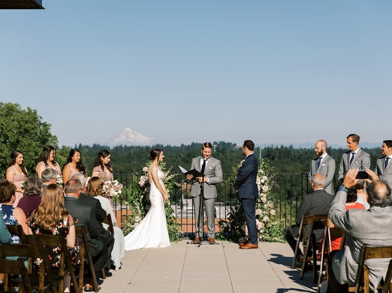 Rooftop wedding ceremony with mountain views at Ironlight
